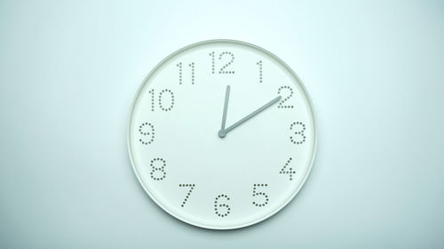 Close-up of clock against white background