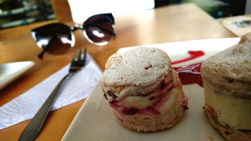 Close-up of desserts in plate on table