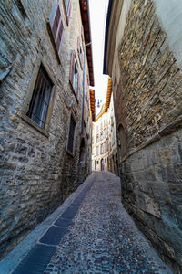 Narrow alley amidst buildings in city