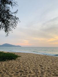 Scenic view of beach against sky during sunset