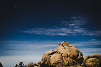 Scenic view of landscape against sky at night