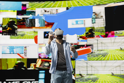 Side view of man standing in factory