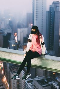 Woman with umbrella in city