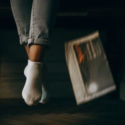 Low section of woman standing on floor