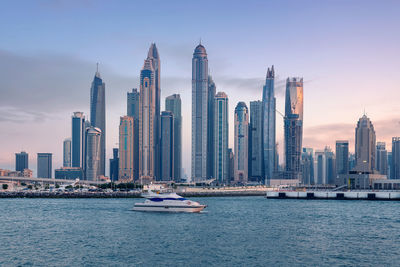 Amazing dubai marina and famous jumeirah beach at sunset, united arab emirates