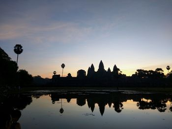 Silhouette of temple against sky during sunset