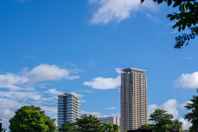 Low angle view of skyscrapers against sky