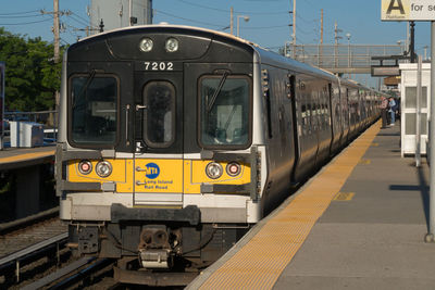 Train at railroad station in city