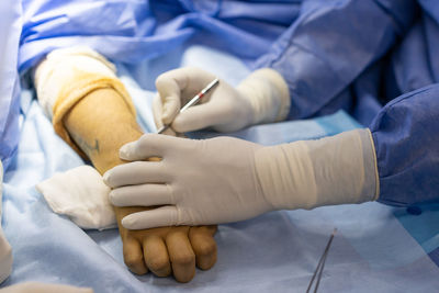 Midsection of doctor holding patient