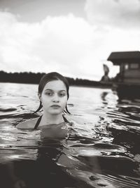 Portrait of woman swimming in pool