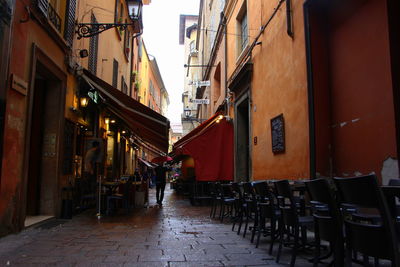 Empty alley amidst buildings in city