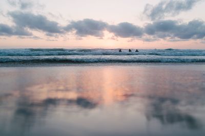 Scenic view of sea against sky at sunset