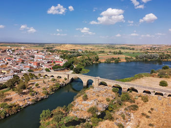 High angle view of buildings in city against sky