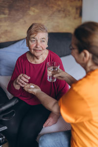 Portrait of young woman sitting in car