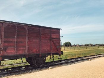 Train on railroad track against sky