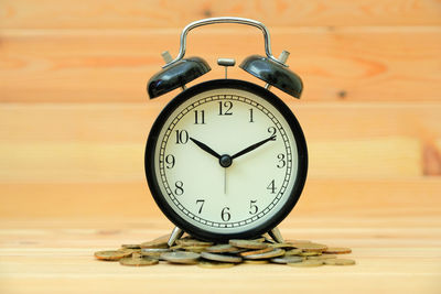 Close-up of clock on table