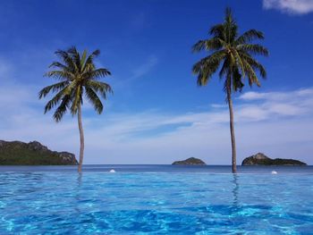 Scenic view of sea against blue sky