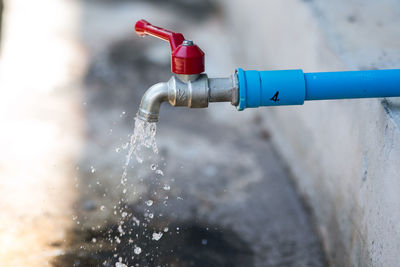 Close-up of water pipe against wall
