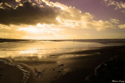 Scenic view of sea at sunset