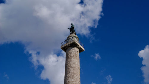 Low angle view of statue against cloudy sky