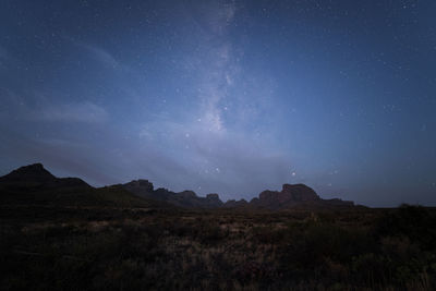 Scenic desert and mountain night under the stars and milky way in big bend national park, texas