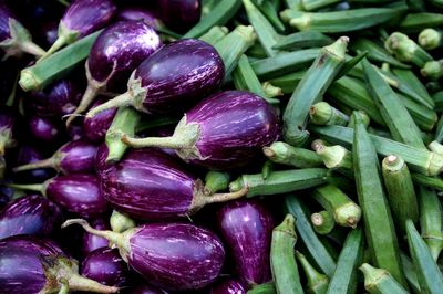 High angle view of eggplant and okras at market stall