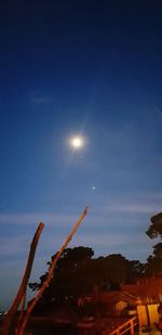 Low angle view of illuminated building against sky at night