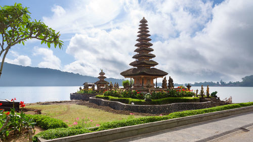 Panoramic shot of building by sea against sky