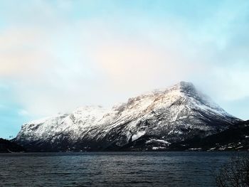 Scenic view of snowcapped mountains against sky during winter