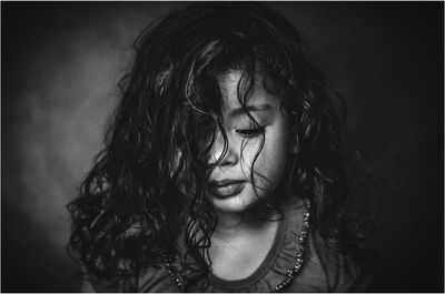 Close-up of girl with curly hair