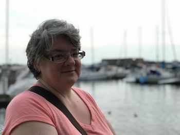 Portrait of smiling mature woman at harbor