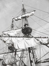 Low angle view of sailing ship against sky