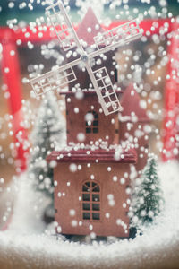 Close-up of red blurred motion of people on snow