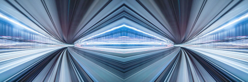 Low angle view of escalator in tunnel