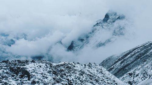 Scenic view of snow covered mountains