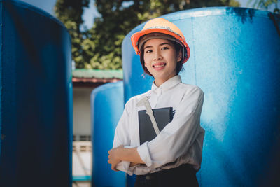 Portrait of smiling engineer working at industry