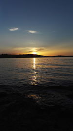 Scenic view of sea against romantic sky at sunset