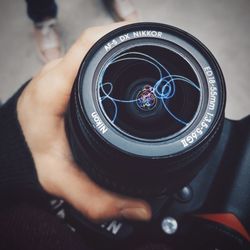 Close-up of hand holding camera