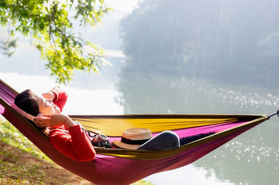 Midsection of woman resting in water