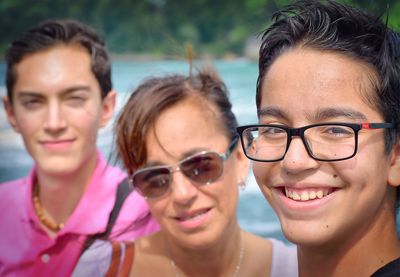 Portrait of mother and sons standing outdoors