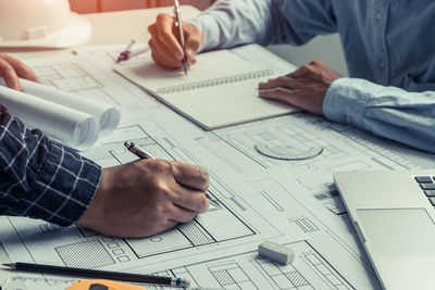 Low angle view of man working on table