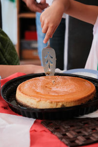 Cropped hand of person preparing food