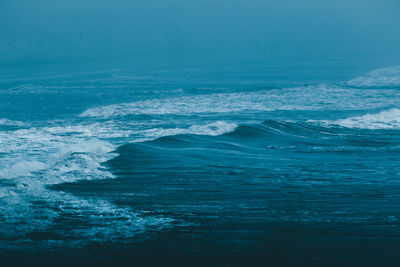 Scenic view of sea against blue sky