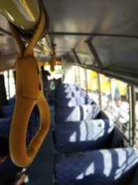 Close-up of yellow light hanging from car