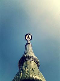 Low angle view of statue against blue sky