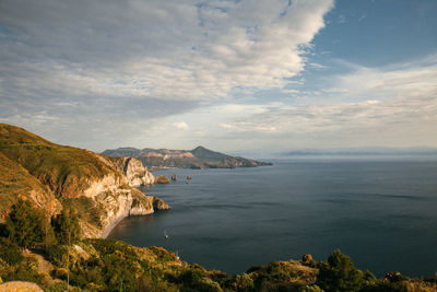 The view on the cliffs, coastline with island on the background, tranquil nature scene.