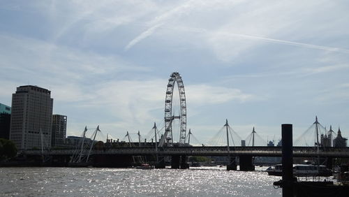 Bridge over river with buildings in background