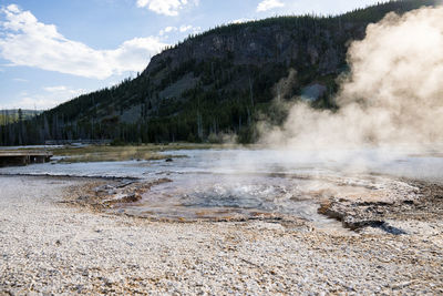 View of smoke emitting from hotspring at yellowstone national park in summer