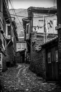 Narrow alley amidst old buildings in town