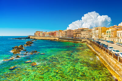 Scenic view of sea against clear blue sky